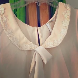 Beautiful cream colored sleeveless blouse!